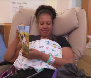 Mom sharing a book with her premature Baby