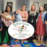 Dr. Betsy Diamant-Cohen, librarian Jenny Gallagher, Judy Center staff, a Spanish language translator, and parent participants at a Hatchlings Program held at a Judy Center in Queen Anne's County.